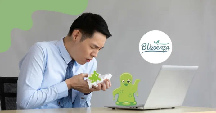 A man in a blue shirt and tie at an office desk looking concerned while holding a tissue with a green mucus illustration, next to a cartoon green slime monster and the Blissenza logo.