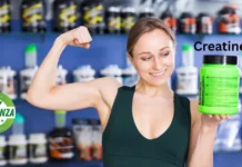 Creatine: Your Ultimate Guide to Boosting Body and Mind woman showing muscle holding a creatine bottle
