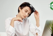 Why Do You Feel Sleepy After Eating? Fix It with These Simple Steps Woman falling asleep in front of computer after eating